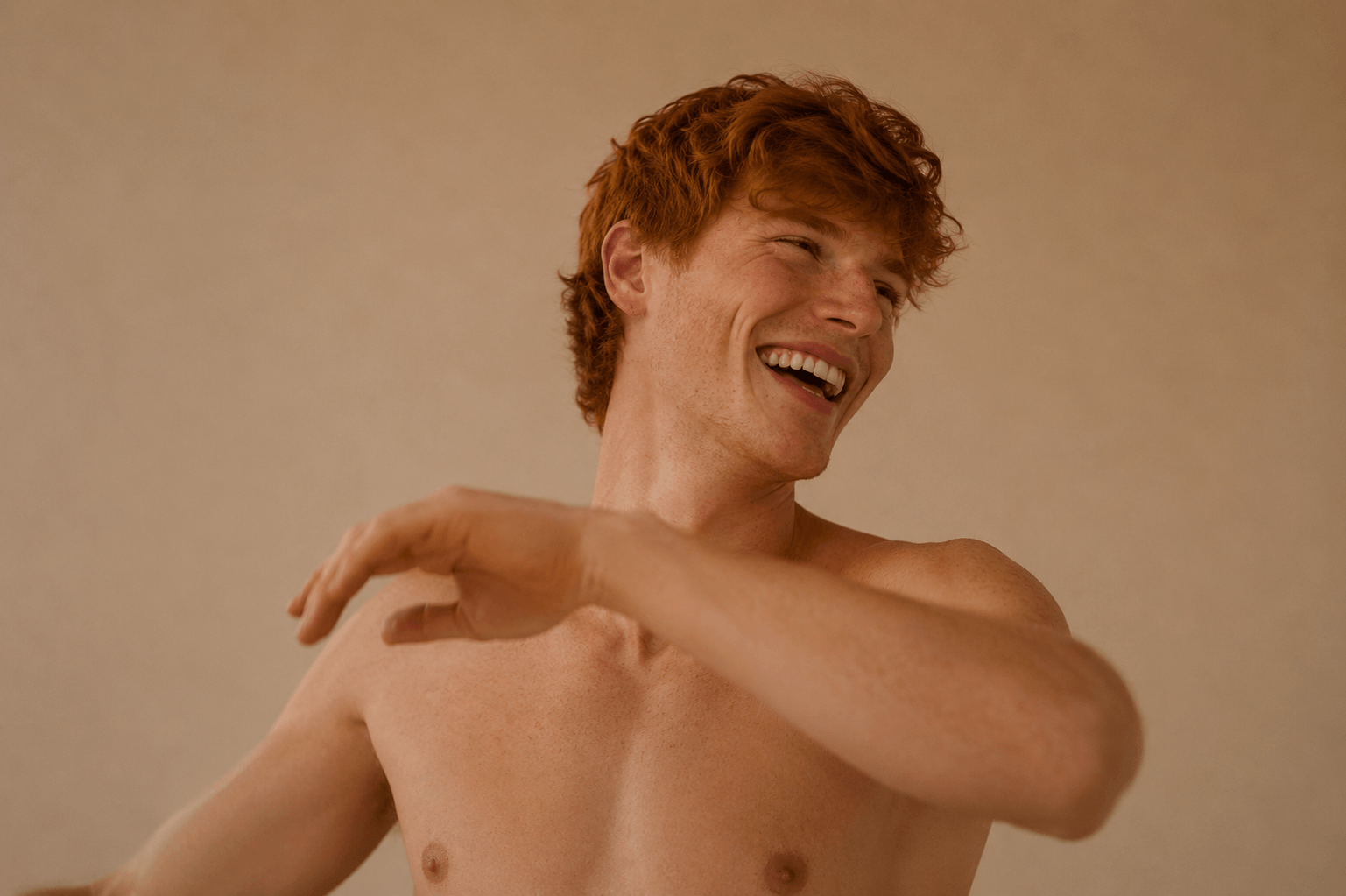 Young red hair ginger twink with naked torso posing for skincare from Suvera