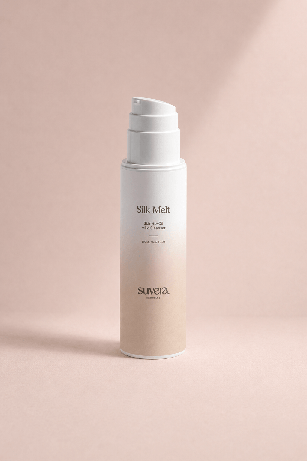 Skincare bottle labeled 'Silk Melt' by Suvera on a pink background Suvera Skincare, conscious beauty