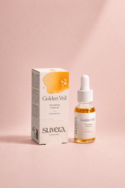 Suvera Golden Veil facial oil packaging and dropper bottle on a pink background Suvera Skincare, nut-free skincare, luxury skincare