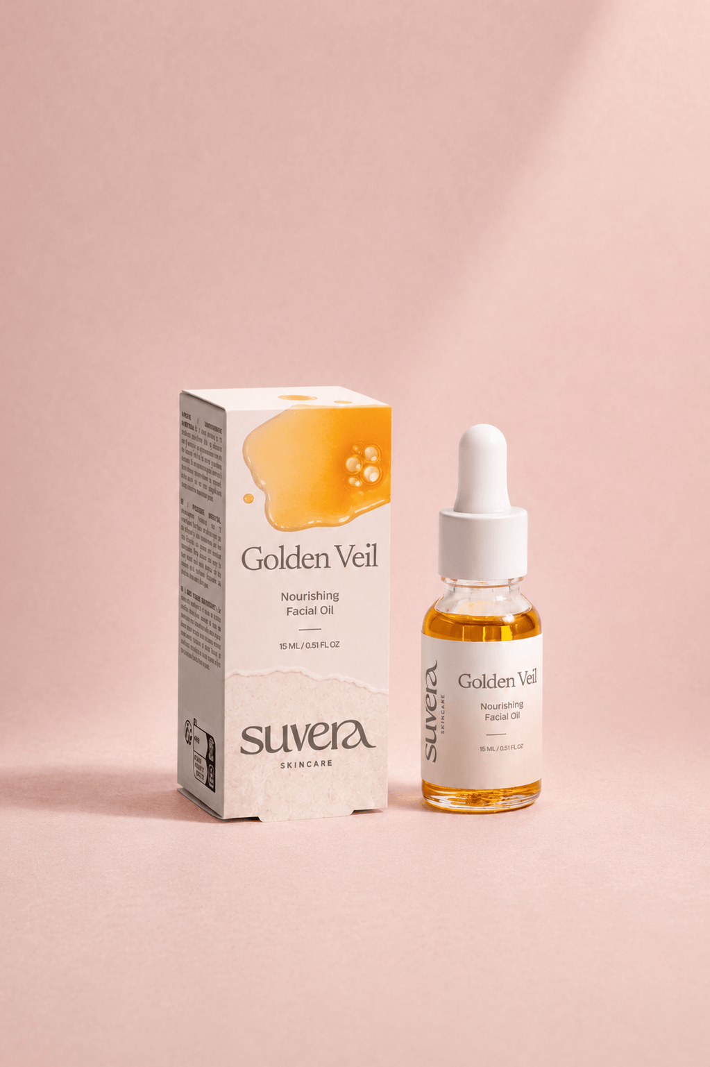Suvera Golden Veil facial oil packaging and dropper bottle on a pink background Suvera Skincare, nut-free skincare, luxury skincare