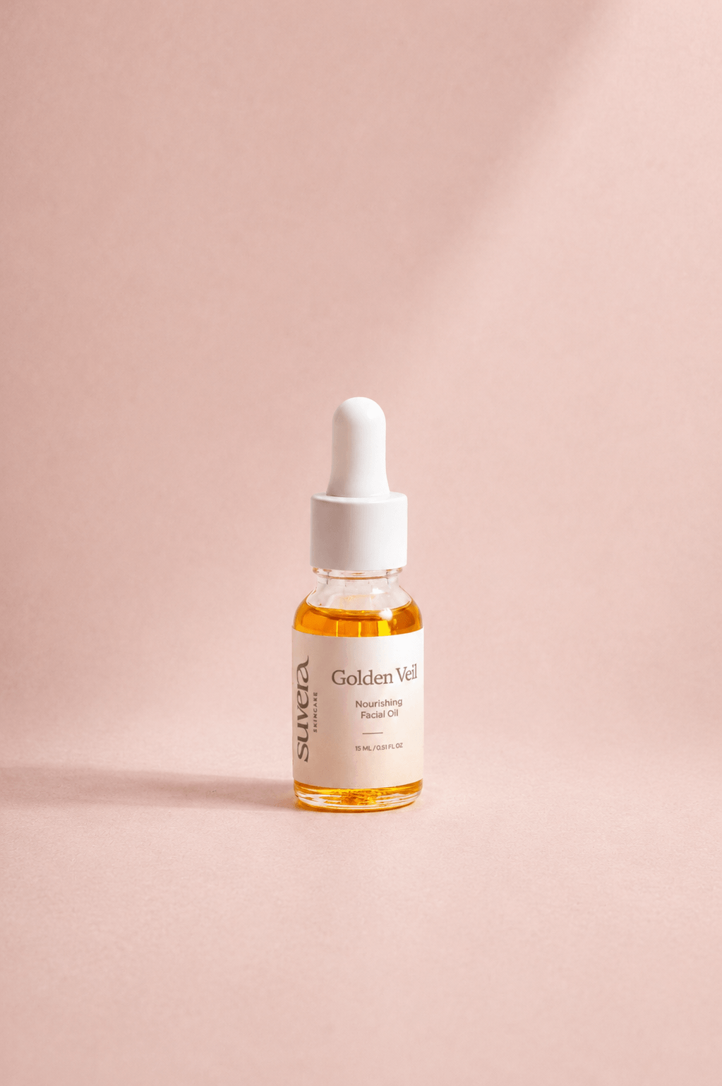 Skincare serum bottle with dropper on a pink background Suvera Skincare, COSMOS certified, skincare rituals