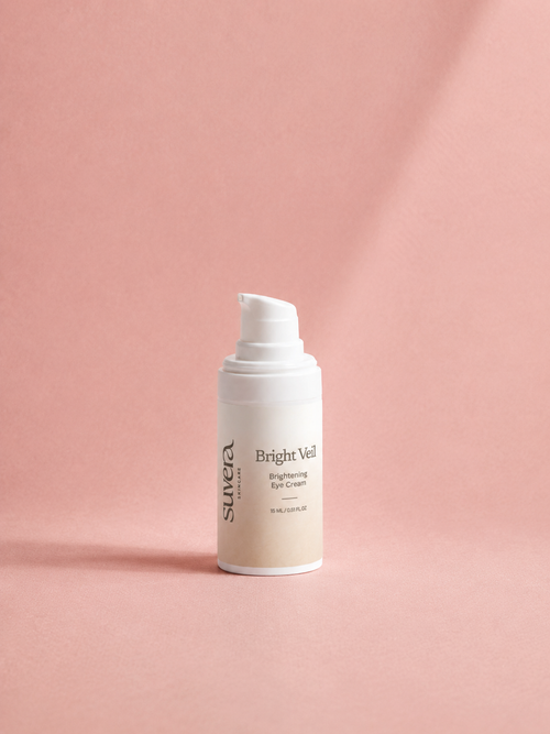 Skincare bottle labeled 'Bright Veil' on a pink background Suvera Skincare, nut-free skincare, COSMOS certified