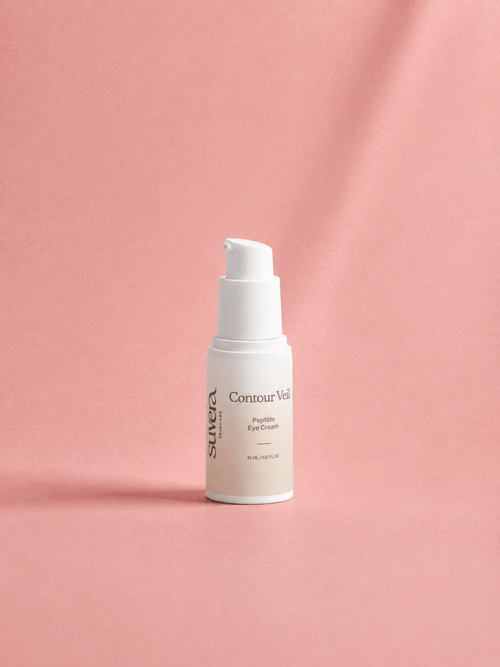 Skincare bottle labeled 'Su:era Contour Visage' on a pink background Suvera Skincare, natural vegan skincare