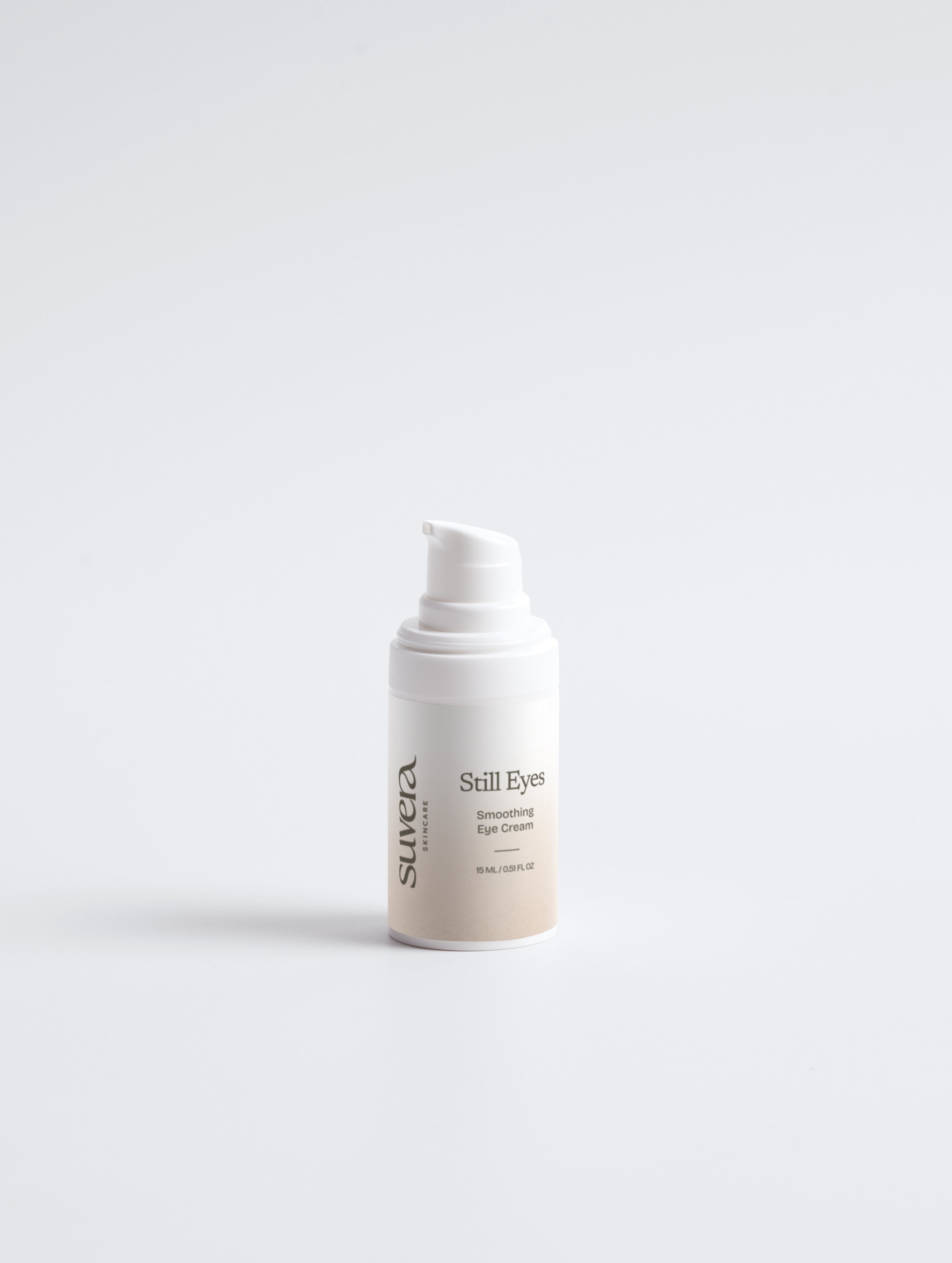 White skincare bottle with a label on a light gray background Suvera Skincare, skincare rituals, vegan skincare
