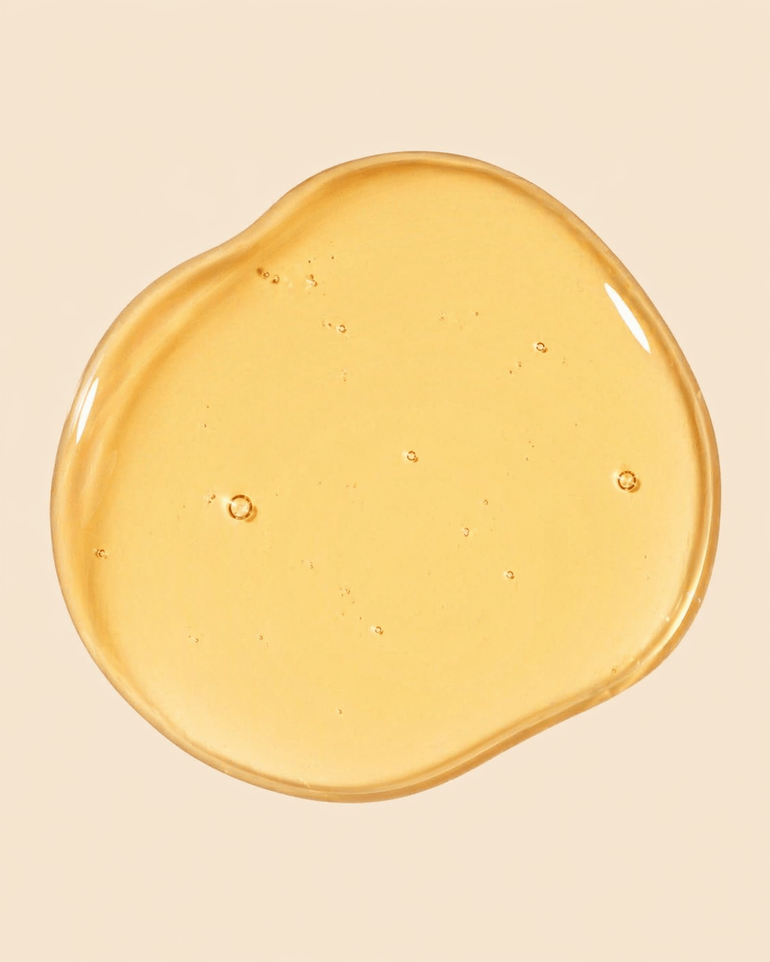 Yellow gel-like substance on a beige background
