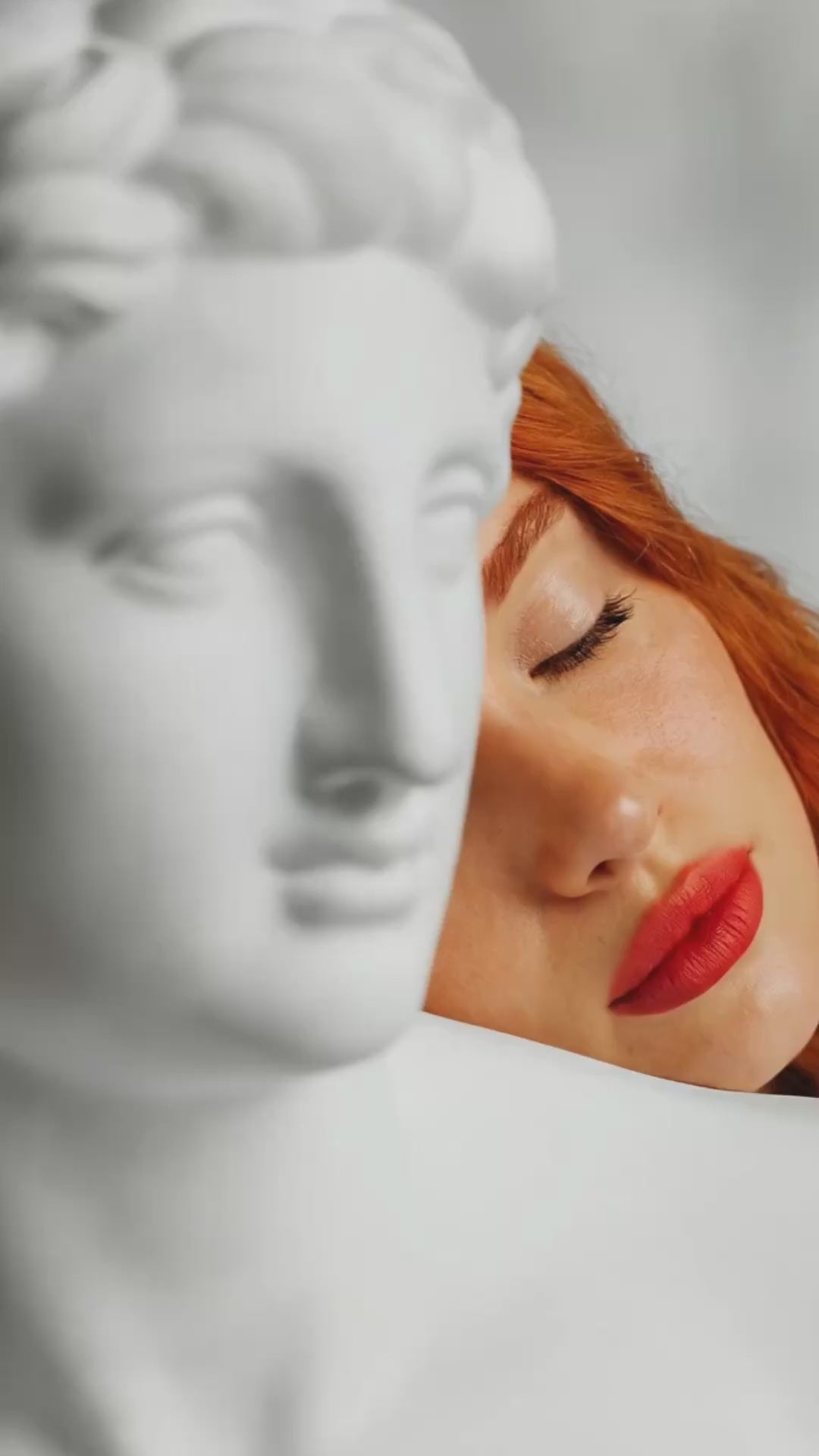 Red headed woman with statue Suvera Skincare, premium skincare, daily ritual