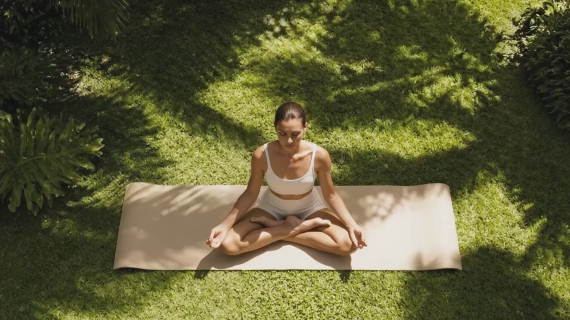 Relaxing woman in Yoga pose in natural setting Suvera Skincare, sensitive skin care, gentle beauty