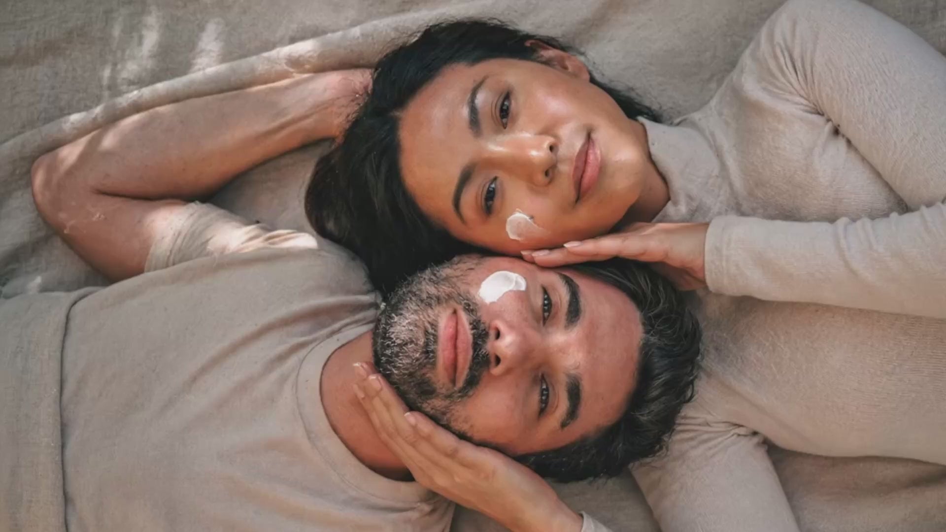 Couple with skincare cream on cheeks Suvera Skincare, hydrating skincare, vegan beauty